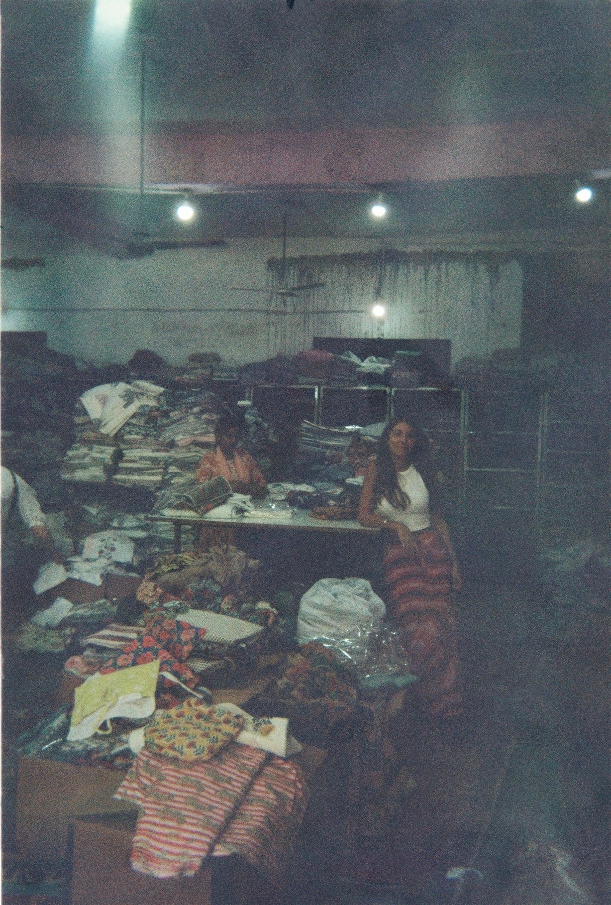 Catarina arranging handmade green ceramics
